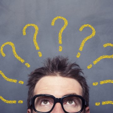 identity guard identity theft protection service man with glasses wondering yellow question marks around his head